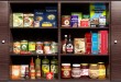 Wooden kitchen cabinet full of food products