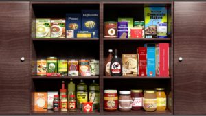 Wooden kitchen cabinet full of food products