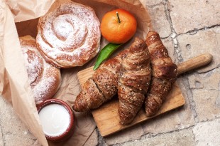 Freshly baked croissants and ensaimada a pastry typical of Mallorca, Spain