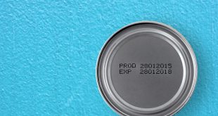manufacture date and expiry date printed on the bottom of aluminum cans on blue cement table background, Information of for consumer, top view