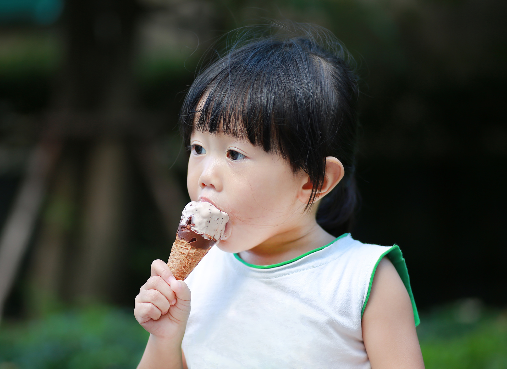 Adorable Little girl eating ice cream