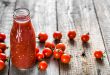 Bottle of tomato juice and fresh tomatoes, organic healthy food concept