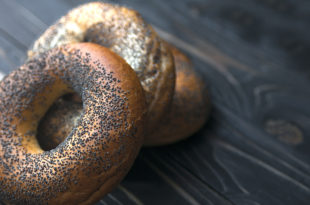 Fresh bagel with poppy seed. Russian traditional bakery product. For bakery pastry banner, ad, poster.