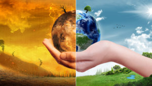 pianeta mano metà distruzione sostenibilità