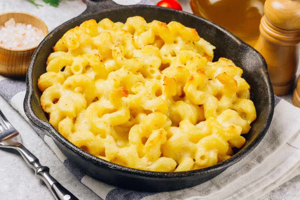 Mac and cheese, american style macaroni pasta with cheesy sauce