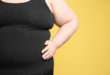 Overweight woman on color background