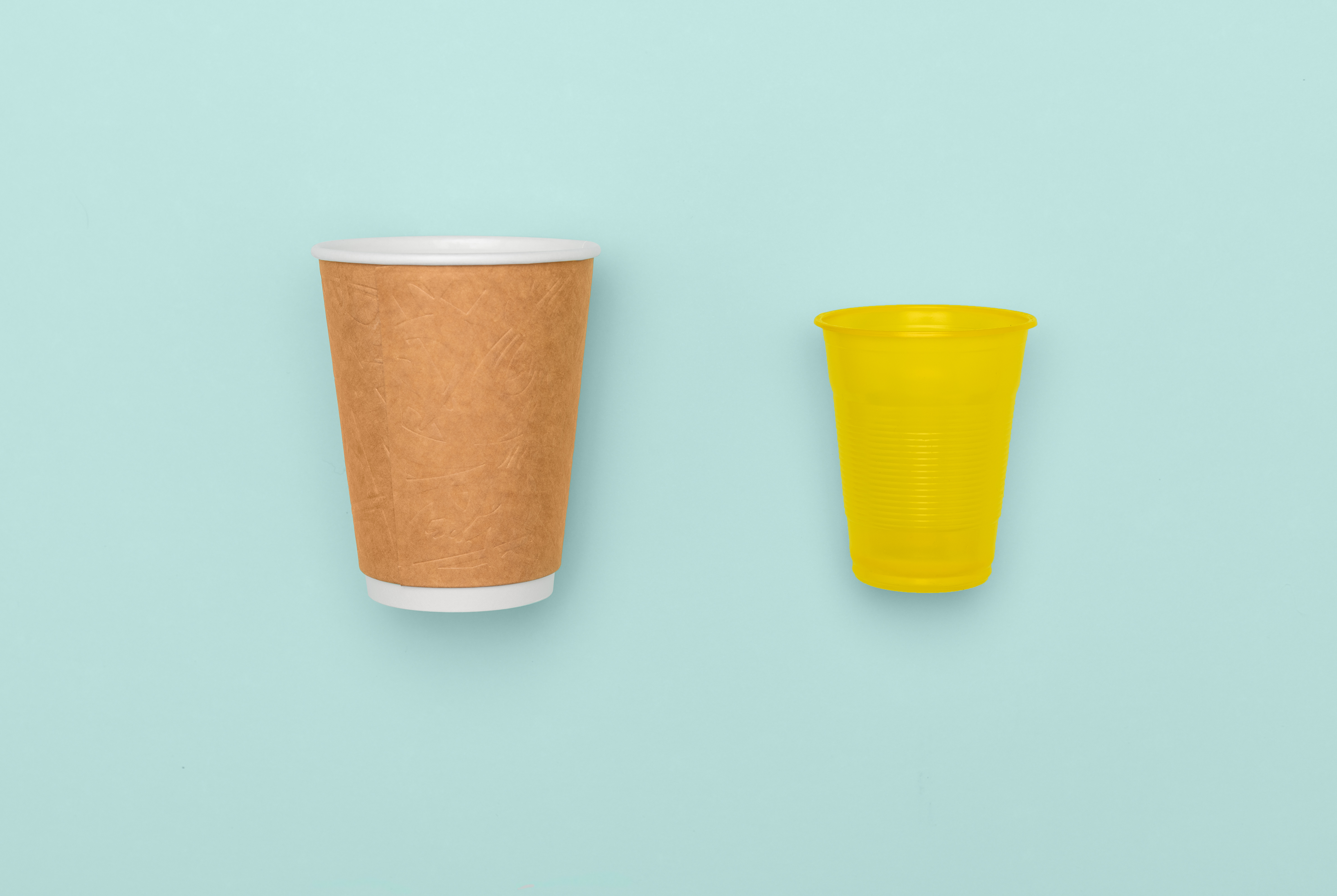 Plastic and paper cups in contrast