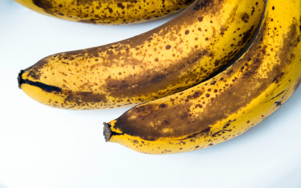 Top view of brown spotted bananas. Banana with dark black spots