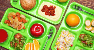 Serving trays with delicious food on table. Concept of school lunch