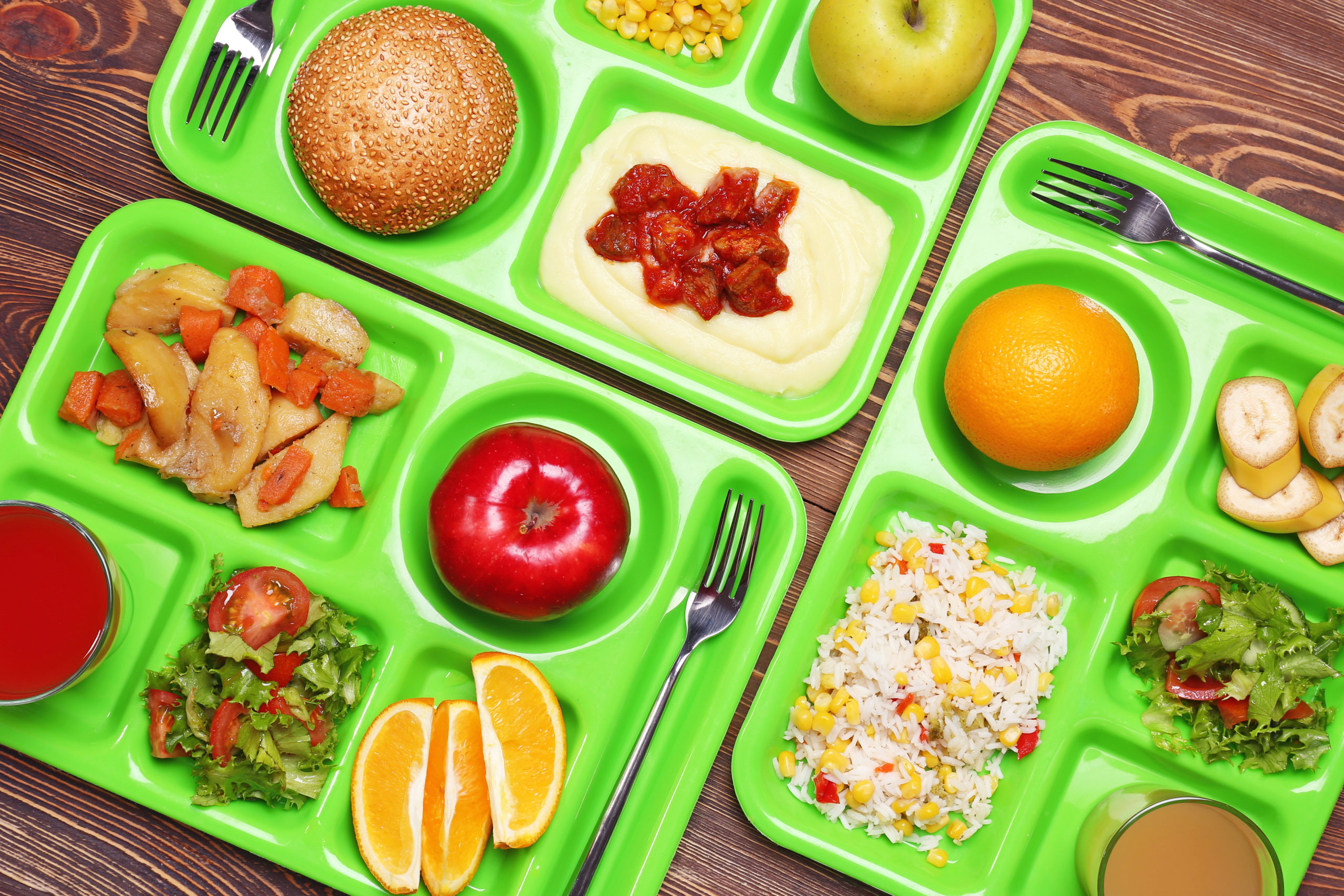 Serving trays with delicious food on table. Concept of school lunch