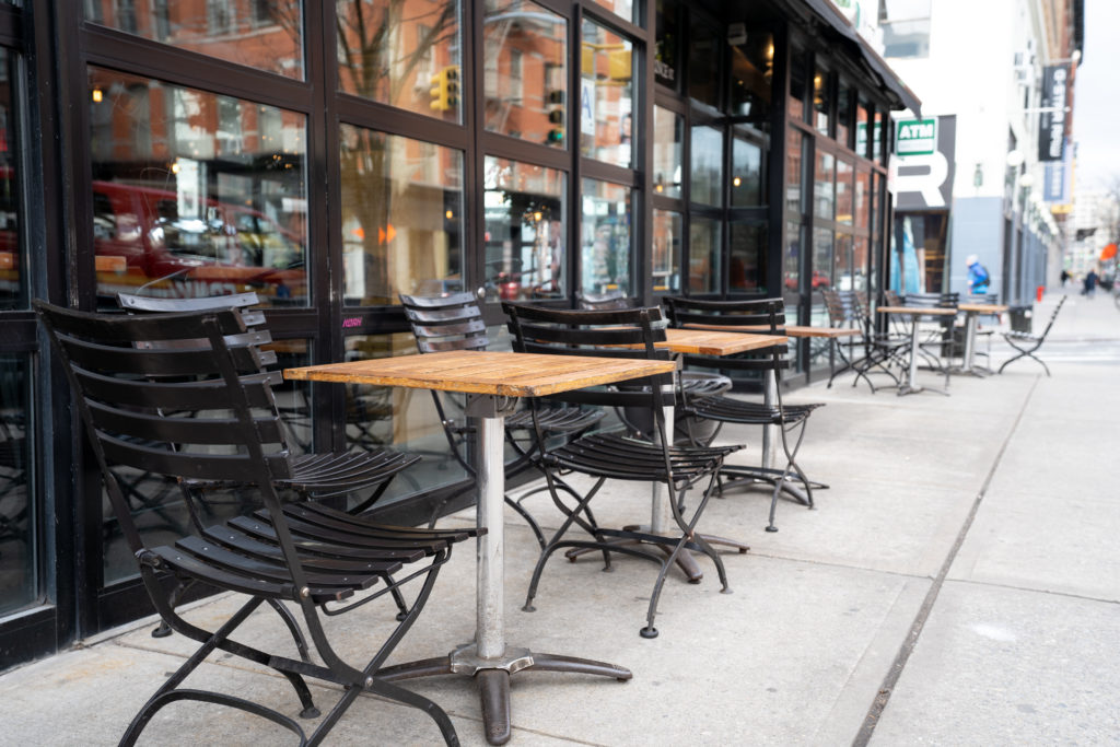 Empty tables of street cafe during New York city lockdown, coronavirus quarantine