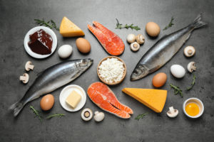 resh products rich in vitamin D on grey table, flat lay