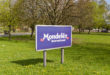 Mondelēz International sign outside the cocoa bean processing factory where chocolate is made in the UK
